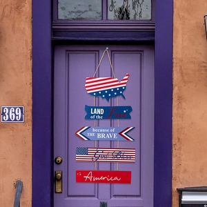 Patriotic wooden USA door sign with rustic twine hanging on a purple door decoration