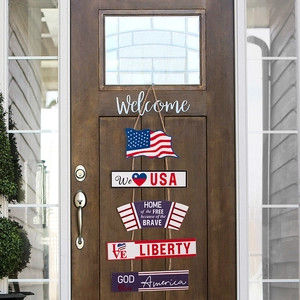 Close-up of USA themed wooden hanging sign with patriotic slogans on a brown wooden door
