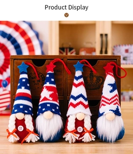 Close-up of four patriotic knit gnomes with stars and stripes for Independence Day decoration