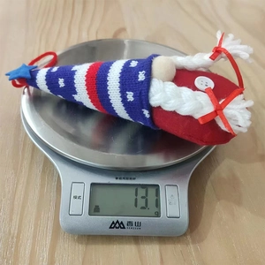Detailed view showing a 13.1g weight measurement of a patriotic knit gnome hanging ornament