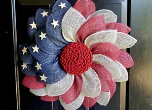 Detailed texture of burlap American flag wreath with stars and red white blue petals