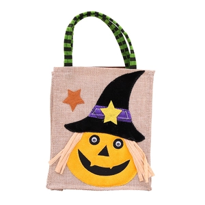 Halloween pumpkin gift bag made of textured burlap with a wizard hat and striped handles