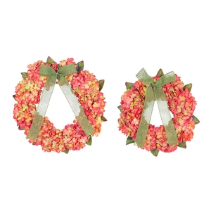 Artificial hydrangea wreath with orange flowers and green bow for autumn home decoration