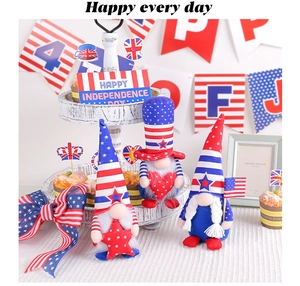 Close-up of three patriotic gnomes with American flag patterns in a festive tiered tray