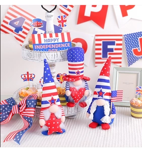 Detailed view of three Fourth of July gnomes set against patriotic festive home decor