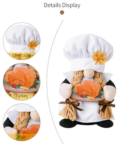 Detail display showing chef's cap, turkey accessory, and plait of the harvest gnome doll
