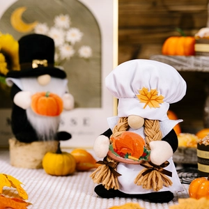 Detailed close-up of chef and pilgrim harvest gnomes holding a turkey and pumpkin