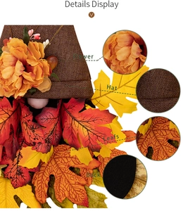 Detail showing artificial silk flowers, burlap hat and autumn maple leaf textures