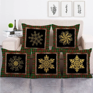 Set of 5 Christmas pillow covers with gold snowflakes and red-green plaid borders on sofa