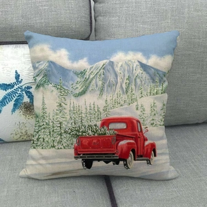Funda de cojín navideña con camión rojo vintage y escena de nieve sobre lino