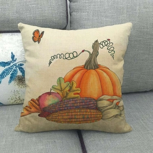 Detailed texture of autumn pumpkin and corn harvest patterns on linen cushion cover