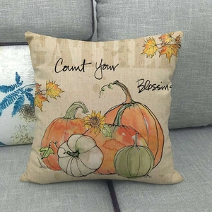 Detailed texture of autumn linen pillow cover with pumpkins and sunflowers pattern