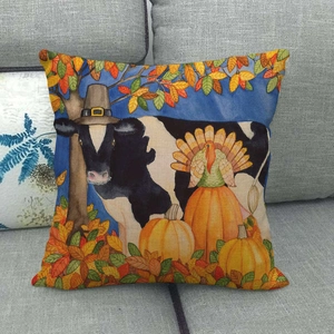 Close-up of linen pillow cover with Thanksgiving cow, turkey, and pumpkin prints