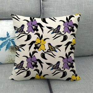 Detail of vintage flower and bird pattern on linen sofa cushion cover texture