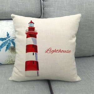 Close-up of linen pillowcase featuring a red lighthouse print and Lighthouse text