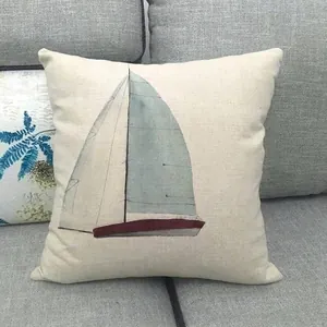 Linen decorative pillowcase featuring a nautical watercolor sailboat on a sofa cushion