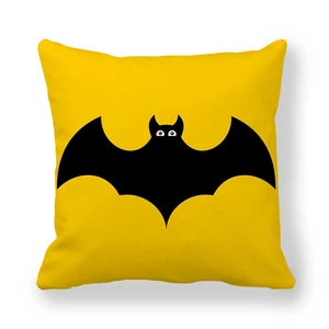 Close-up of yellow peach skin pillowcase featuring a black bat silhouette print