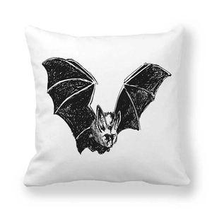 Close-up of hand-drawn black bat sketch on white peach skin velvet pillowcase texture