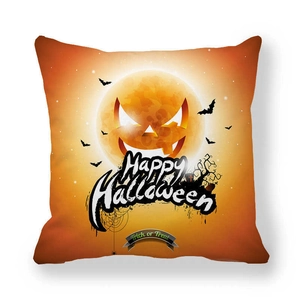 Detail of Jack-o'-lantern print on a square orange Halloween pillowcase with bats