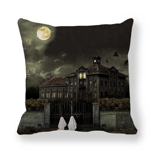 Close-up of Halloween haunted house cushion cover with ghosts under the full moon