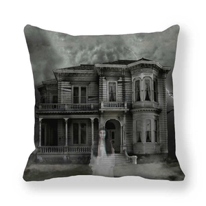Detailed close-up of Halloween ghost and haunted house print on thick peach skin pillowcase