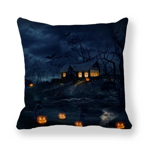 Detail of Halloween house cushion cover with glowing pumpkins and bats on dark fabric