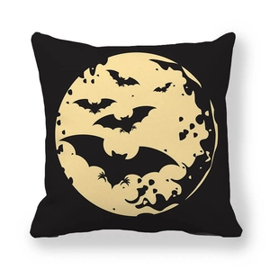Close-up of Halloween pillowcase featuring black bat silhouettes against a yellow full moon