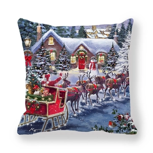 Close-up of peach skin Christmas cushion cover featuring Santa and reindeer in snow