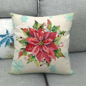 Detail of Christmas poinsettia linen pillowcase featuring winter floral and snowflake pattern