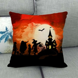 Detail of Halloween linen pillowcase featuring silhouettes of castle and bats on a sofa