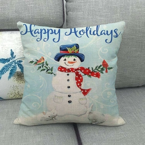 Detail view of linen pillowcase featuring a happy holidays snowman and winter animals