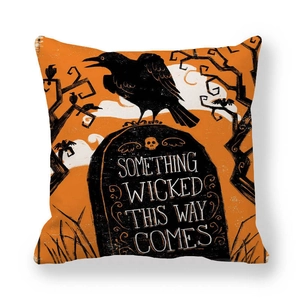 Close-up of Halloween pillowcase featuring a black crow on a tombstone and text