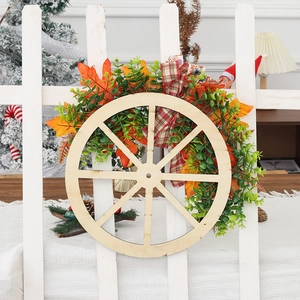 Rustic Thanksgiving wreath with wooden wheel, orange maple leaves, and plaid bow decoration