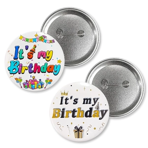 Close-up of 58mm birthday tinplate badges with metal pin back and colorful party designs