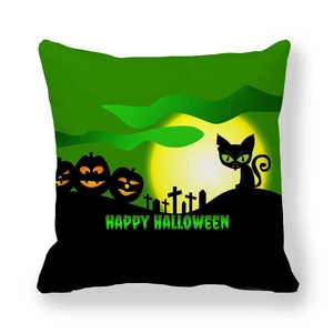 Close-up of black cat and pumpkin print on thick peach skin Halloween cushion cover