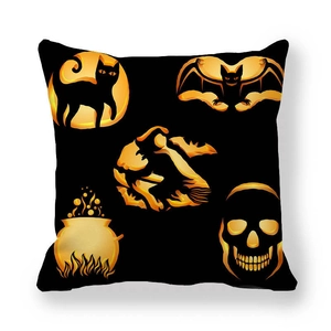 Detail view of peach skin pillowcase with gold Halloween pumpkin and witch graphics