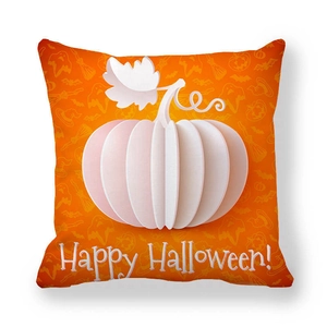 Detail of orange peach skin pillowcase with white pumpkin design and Happy Halloween text