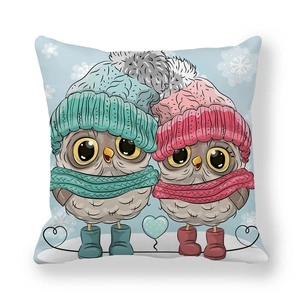 Detail of soft peach skin cushion cover featuring cartoon winter owls and snowflakes