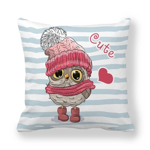 Detail of cartoon owl print on striped peach skin pillowcase with cute winter accessories