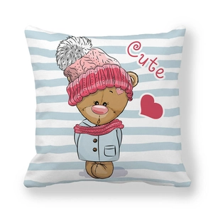 Close-up of peach skin fabric cushion cover with a cute cartoon bear in blue stripes