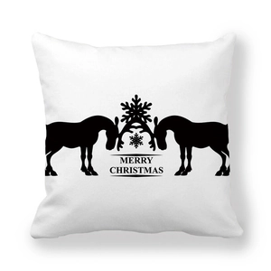 Close-up of white peach skin cushion cover with black Christmas deer and snowflake print