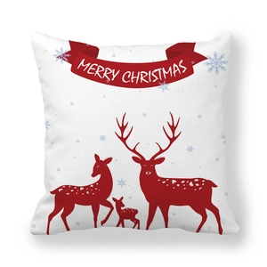 Close-up of Christmas reindeer pattern and Merry Christmas text on a square pillowcase