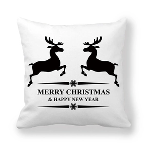 Detail of Christmas reindeer silhouette and holiday greetings on peach skin pillowcase