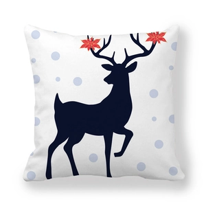 Close-up of reindeer silhouette with red flower detail on peach skin pillowcase