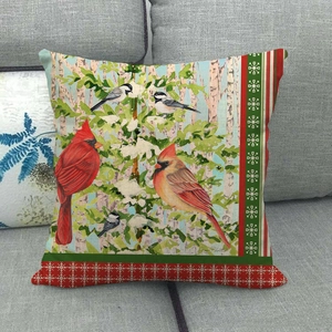 Detailed texture of linen cushion featuring northern cardinal and birch trees on sofa