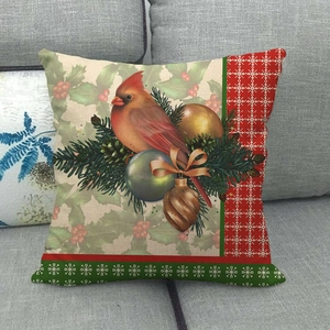 Detailed view of cardinal bird and pine branch pattern on Christmas linen pillowcase