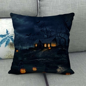 Detailed view of Halloween spooky house print on square linen pillow cover on sofa