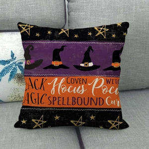 Detail of Halloween throw pillow cover with witch hat motif and festive typography