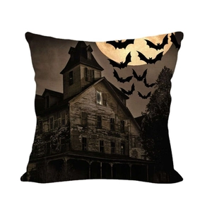 Halloween pillow cover featuring a spooky haunted house, full moon, and bats on linen fabric