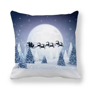 Detail of Christmas pillowcase showing Santa and reindeer flying over a snowy pine forest